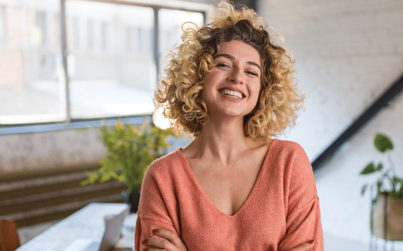 woman smiling after receiving ericksonian hypnosis in nyc